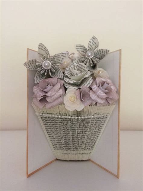 folded book vase|book folding vase with flowers.